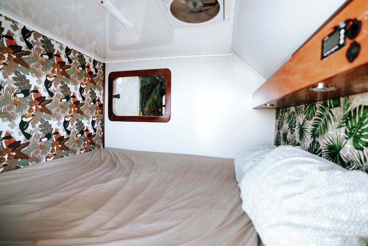 The bed inside the Kia Bongo camper cabin