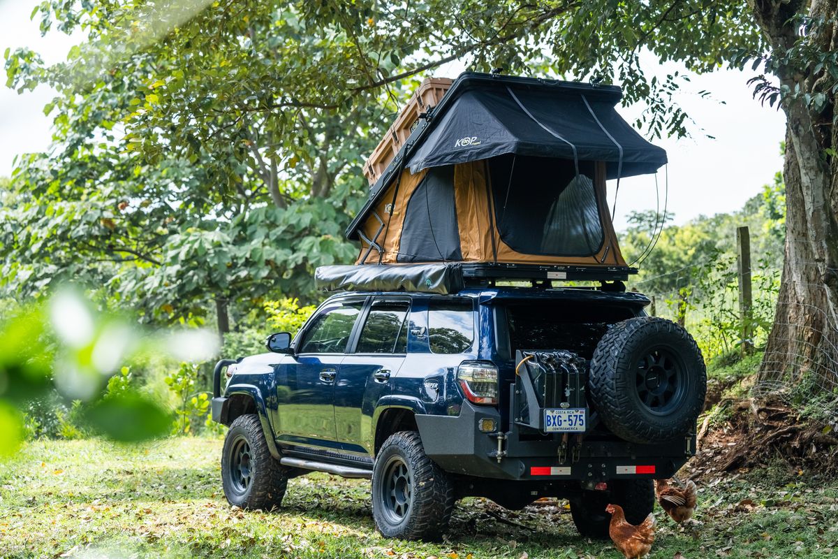 Toyota 4Runner Premium seen from behind with its hard-shell rooftop tent open